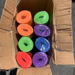 8 yoga mats with 10 carrying straps. Multiple colors